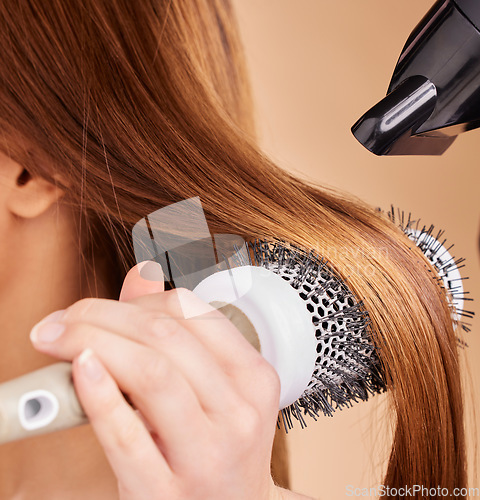 Image of Hair, closeup and woman with hairdryer in studio for beauty, blowing and styling on brown background. Zoom, haircare and girl with salon treatment, hairstyle and hairdressing appliance isolated