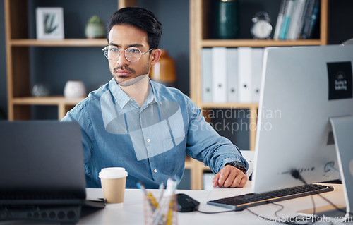 Image of Serious, laptop and business man in office for startup management, digital planning and trading. Focused male worker at computer technology for online project, website and internet research at table