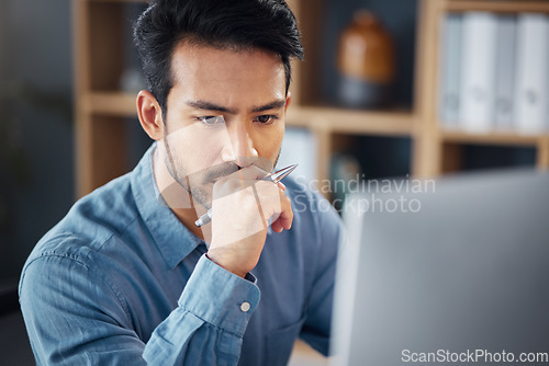 Image of Serious, business man and thinking on computer in office, internet research and website. Focused male employee, desktop and solution of ideas, planning decision and review strategy, project or vision