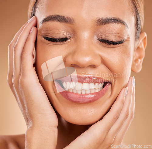 Image of Smile, self love and hands on face of woman in studio for makeup, skincare and cosmetics on brown background. Closeup, beauty and happy girl model relax with natural and glowing skin while isolated