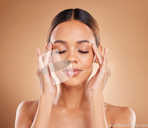 Image of Beauty, calm and a woman with hands on face for skin care glow and natural shine in studio on brown background. Aesthetic model happy and satisfied with spa facial, dermatology cosmetic and wellness