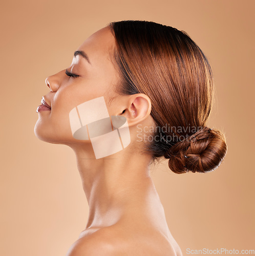 Image of Beauty, face and a woman profile for skin glow and shine in studio on brown background. Aesthetic female model satisfied with spa facial, dermatology cosmetic and wellness with skincare or self care