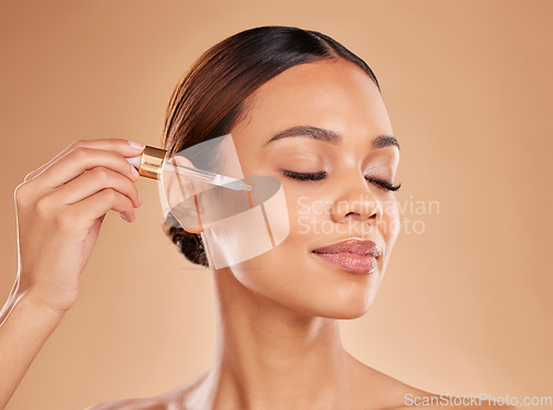 Image of Beauty serum, oil or model woman in studio on beige background in a facial skincare grooming spa. Face, eyes closed or natural girl with essential oils or glowing luxury self care hydration products