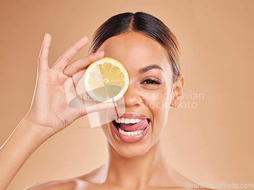 Image of Lemon, skincare and face of woman with smile in studio for wellness, facial treatment and natural cosmetics. Beauty, spa aesthetic and happy girl with fruit slice for detox, vitamin c and dermatology