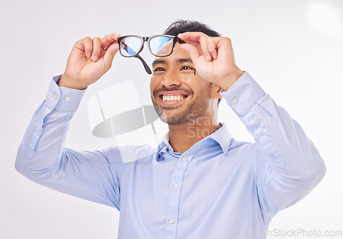 Image of Glasses, vision and man happy in studio for eye care, lens or frame isolated on a white background. Smile of excited asian male model face with optometry eyewear in hands to check eyesight or focus