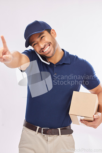 Image of Phone call, delivery smile and Asian man with box in studio isolated on a white background. Shipping, logistics and happy male courier with package and cellphone for ecommerce, talking or chatting