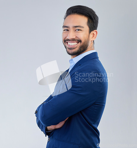 Image of Business man, arms crossed and smile portrait in studio for corporate or CEO fashion while happy. Face of asian entrepreneur person on isolated white background with pride for career and success