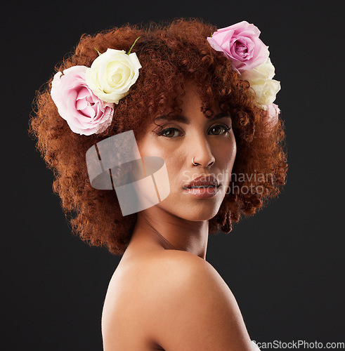 Image of Face, beauty and flowers with a model black woman in studio on a dark background for natural skincare. Wellness, luxury and portrait with an attractive young female wearing a flower crown or wreath