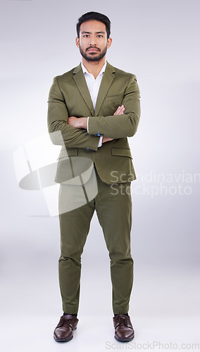 Image of Serious, business man and portrait of arms crossed in studio, white background and professional worker. Focused entrepreneur, male model and leadership in suit, corporate power and assertive attitude