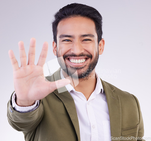 Image of Portrait, smile and Asian man with stop, hand and communication against grey studio background. Face Japanese male or guy with gesture for warning, sign language and welcome with opportunity or smile