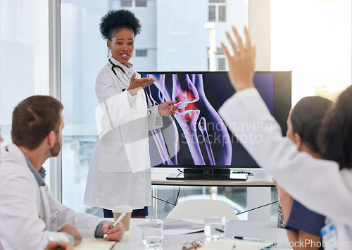 Image of Medical presentation, woman and doctors xray with hospital team with question. Orthopedic research, happy and collaboration workshop of a health and healthcare group in clinic for diagnosis strategy