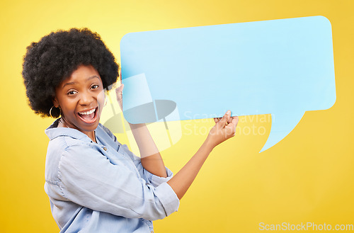 Image of Excited, speech bubble and portrait of black woman in studio with mockup for social media, advertising or space. Face, paper and happy lady with billboard for news or poster on yellow background