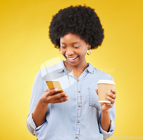 Image of Happy, phone and black woman with coffee in studio, texting and laughing against yellow background. Smartphone, message and female with tea while browsing social media, app or online dating website