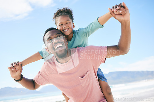 Image of Beach, black man with child on piggy back and smile on playful family holiday in Australia with freedom and fun. Travel, happy father and girl playing, flying and bonding together on ocean vacation.