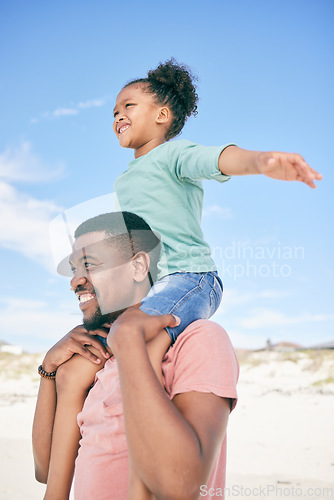 Image of Beach, man with child and piggy back on shoulders on holiday in Australia with ocean fun. Travel, smile and happy black family, dad and girl playing, flying and bonding together on vacation in nature