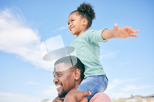 Image of Child, black man and piggy back at beach on playful family holiday in Australia with freedom, blue sky and fun. Travel, smile and happy dad and girl playing, flying and bonding together on vacation.