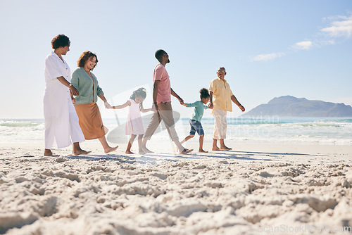 Image of Holding hands, vacation and family on beach, walking and break to relax, happiness and ocean water waves. Grandparents, father and mother with grandkids, seaside holiday and quality time together