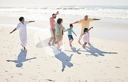 Image of Family have fun on beach, freedom and generations with travel and grandparents with parents and kids. Adventure, happy people outdoor and carefree, excited running and playful, happiness on vacation