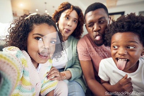 Image of Happy, tongue and selfie with black family in living room for social media, bonding and funny face. Happiness, picture and care with parents and children at home for memory, support and weekend