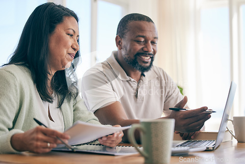 Image of Budget, finance and happy interracial couple planning home investment, savings or mortgage and taxes together in the living room. Married people review financial insurance document or paperwork