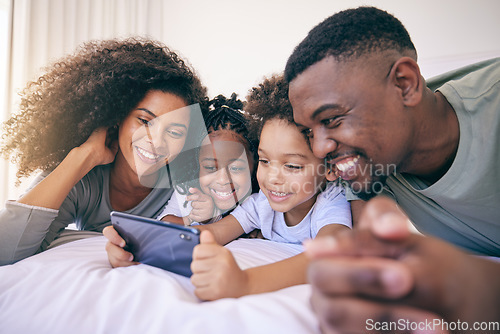 Image of Phone, bedroom and family watching a video on social media, mobile app or the internet together. Happy, bonding and African children streaming a movie or film on cellphone with their parents at home.