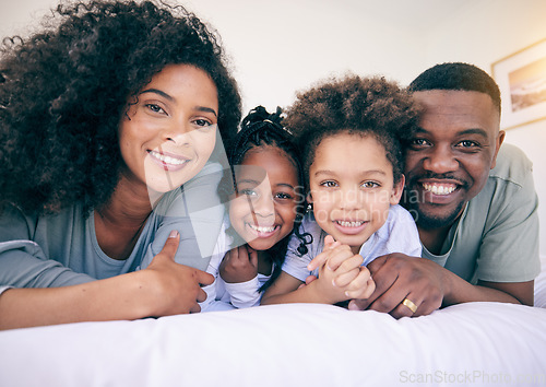 Image of Black family smile, happiness and portrait of a mother, father and girl children on a house bed. Bedroom, home and happy kids with parent love and support from mama and dad together in the morning