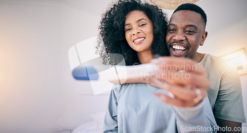 Image of Pregnancy test, woman hands and happy black couple in a home with a smile from baby news. Support, care and marriage of a young and new mother and dad together feeling love with pregnant female