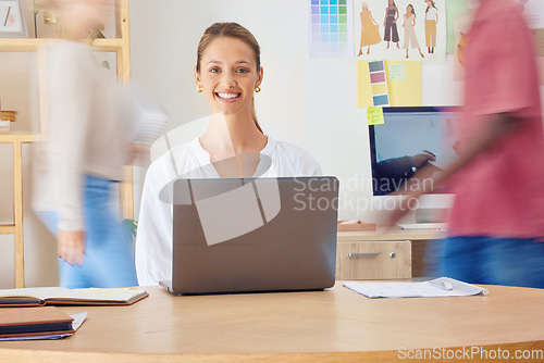 Image of Busy office, woman portrait and laptop of a female fashion designer and stylist with a smile in office. Website, ecommerce analytics and design research of a young person working style business app