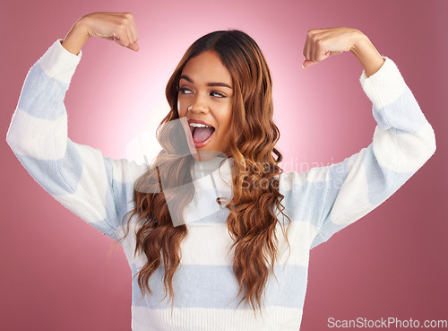 Image of Smile, power and woman flexing arms, freedom and excited gen z model in studio on pink background. Feminism, empowerment and strength, happy and strong girl isolated and confident win for challenge.