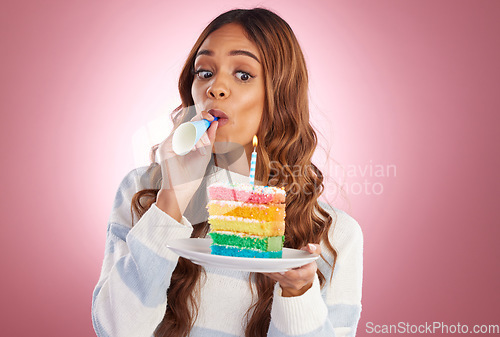 Image of Happy, cake and celebration with woman in studio for birthday, party and event. Rainbow, dessert and cheering with young female isolated on pink background for food, happiness and festive treat