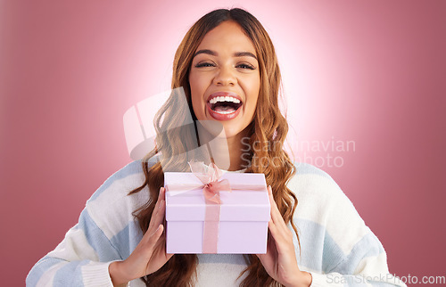 Image of Woman, gift and box in studio portrait with happiness, surprise and celebration by gradient background. Student girl, young and happy with present package, excited face and celebrate for birthday