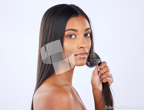 Image of Woman, strong hair and beauty and haircare in portrait with cosmetic care and keratin treatment on studio background. Serious, Indian female with hairstyle and skin glow, Brazilian and cosmetics