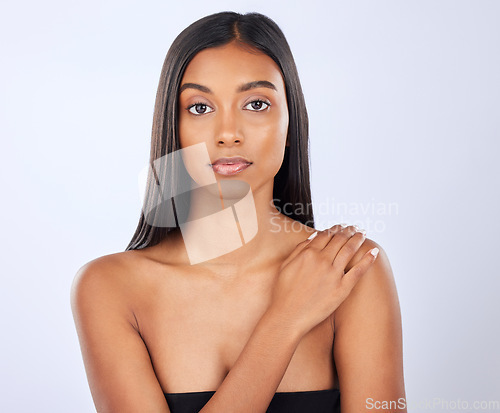 Image of Woman, hair and beauty in portrait, cosmetic care and keratin treatment with haircare on studio background. Serious, Indian female with hairstyle and skin glow, Brazilian and cosmetics with growth