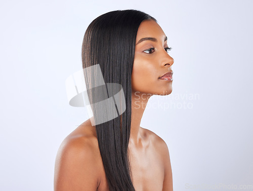 Image of Woman, straight hair and beauty, cosmetic care and keratin treatment with haircare on studio background. Serious, Indian female with hairstyle and skin glow, Brazilian and cosmetics with growth