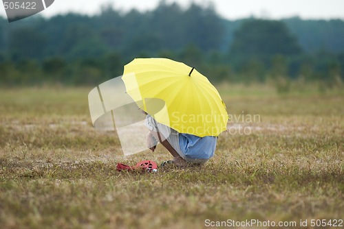 Image of Man with yellow umbrella