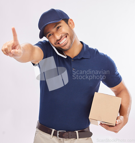 Image of Phone call, delivery and man with box in studio isolated on a white background. Shipping, logistics and smile of happy Asian male courier with package and cellphone for ecommerce, talking or chatting