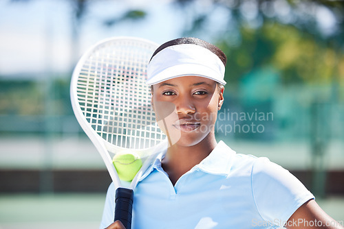 Image of Tennis, face portrait and serious black woman on court ready for match, game or competition. Fitness, sports racket and young, proud and confident female athlete from Nigeria preparing for training