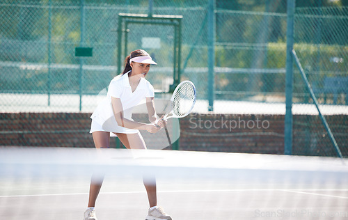 Image of Tennis fitness, outdoor match and woman hit a sports ball with a racket on a exercise court. Sport game, workout competition and young female doing cardio action for wellness and health in summer