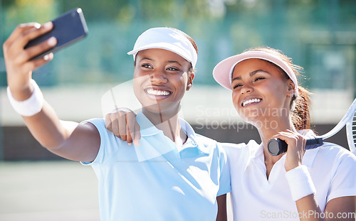 Image of Tennis, selfie and friends at court for training, match or exercise on blurred background. Sports, women and social media influencer smile for photo, profile picture or blog while live streaming