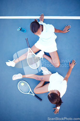 Image of Top view, tennis and women tired, conversation and exhausted after match, training and happiness for sport. Female athletes, players or friends with rackets, workout or practice for healthy lifestyle