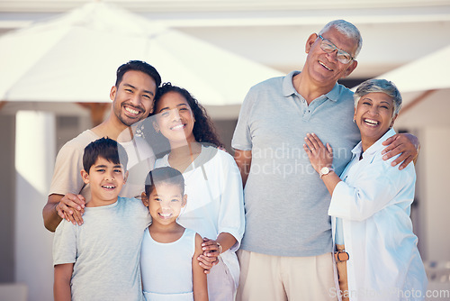 Image of Hug, smile and portrait of big family at new home for bonding, affectionate and care. Relax, quality time and natural with parents and children in garden for happiness, generations and support