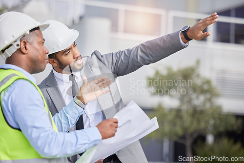 Image of Teamwork, engineering and leader with blueprint at construction site for development. Architecture, collaboration and people, contractor men or architect colleagues pointing, planning and discussion.