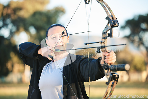Image of Woman, bow or arrows aim in sports field, shooting range or gaming ground for hunting, hobby or performance exercise. Person, archery or athlete and weapon in target training, competition or practice