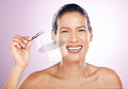 Image of Beauty, portrait and woman with tweezers in studio for mature facial hair removal routine. Self care, grooming and female model plucking her eyebrows for face epilation treatment by purple background