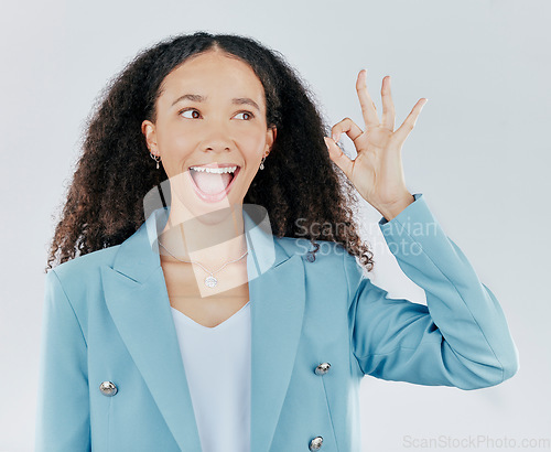 Image of Woman, okay sign and wow face in studio for agreement, support and success. Excited female person thinking and hand gesture emoji for thank you, sale or agreement isolated on a white background