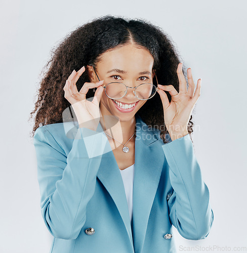 Image of Smart, happy and portrait of a woman with glasses isolated on a white background in a studio. Smile, intelligent and the face of a girl with eyewear, showing eyeglasses and accessory for vision