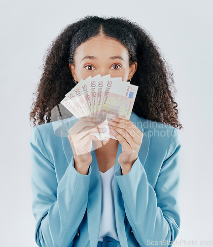 Image of Portrait, eyes and cash with a business woman in studio on a gray background making a perfect hand gesture. Wow, finance and money with a surprised female employee holding euro bills for investment