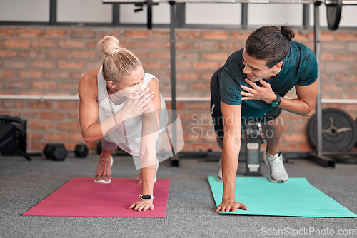 Image of Fitness, push up and woman with partner, personal trainer or gym coach for support, teamwork and muscle goals. Athlete, sports and couple of friends in strong workout, exercise or training together