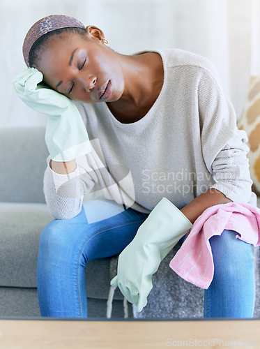 Image of Housework, exhausted and woman cleaner on a sofa taking a break while spring cleaning a home. Tired, stress and African female maid or housewife sleeping in the living room after working at a home.