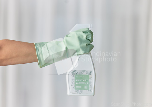 Image of Hands, gloves and housekeeping with detergent spray bottle for spring cleaning, disinfection or dirt removal at home. Hand of cleaner holding sanitizer and rubber glove for clean hygiene or disinfect